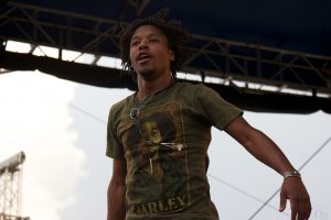 Close up of artist Lupe Fiasco on stage.