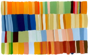 An abstract pattern of rectangles in a variety of muted earth tones, ranging from oranges to greens, blues, and browns.