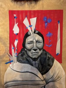 Mostly finished portrait with white paper pieces taped on with painters tape to protect certain areas as she continues to work.