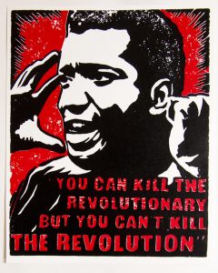 Printed poster of Fred Hampton with the quote "You can kill the revolutionary but you can't kill the revolution" in red under his face.