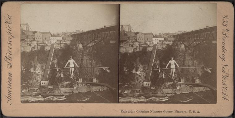 Stereoscopic image aligned side by side featuring the same image. The photographs are of a man tightrope walking across the Niagara Gorge.