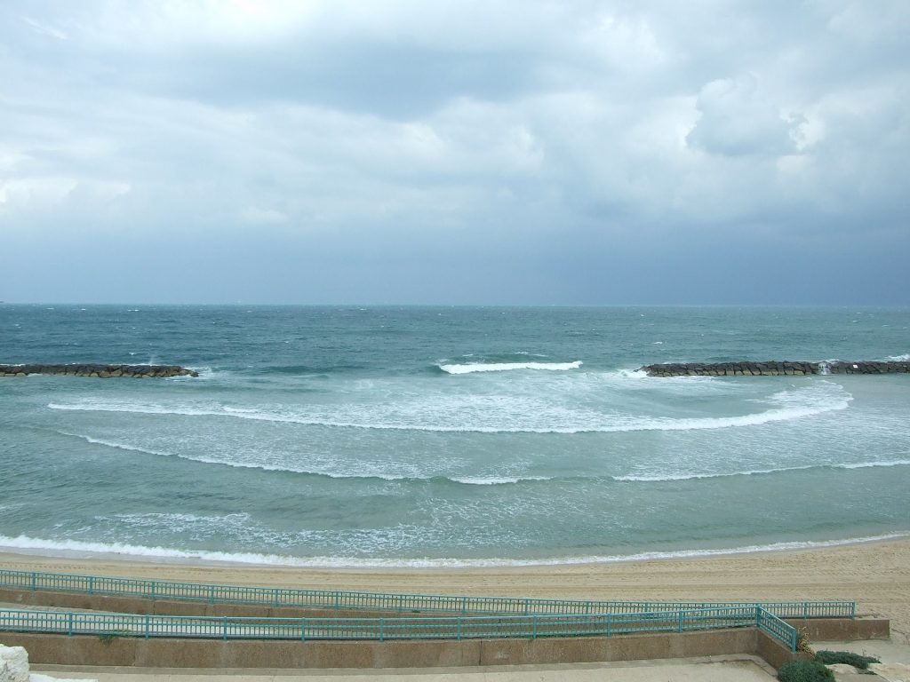 Waves can bend around corners. Here we see water waves bending around the corners of a jetty.