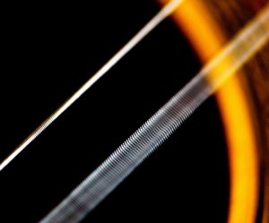 Close-up of a vibrating guitar string