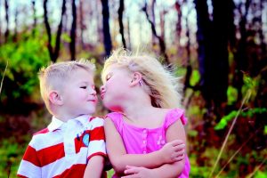 kids kissing each other